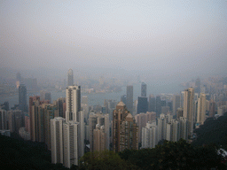 The skyline of Hong Kong and Kowloon with the International Commerce Centre, under construction, the Two International Finance Centre, the Bank of China Tower and the Central Plaza building, and Victoria Harbour, viewed from Victoria Peak, at sunset