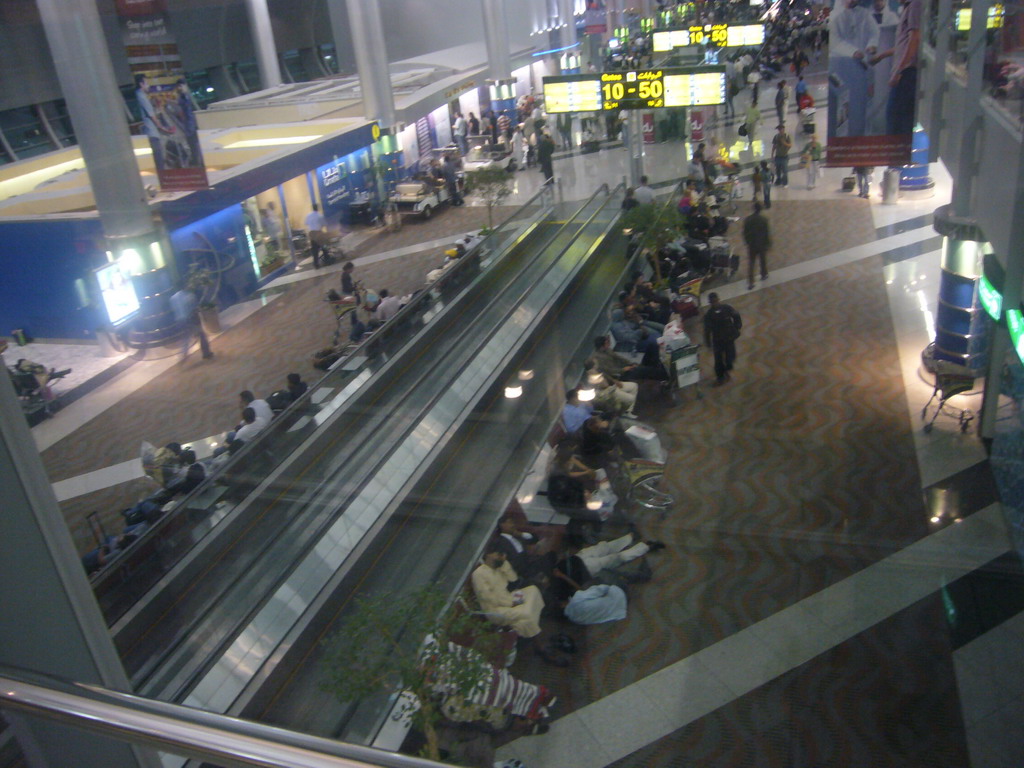 Stranded travellers at the Transit Hall of Dubai International Airport, viewed from the first floor