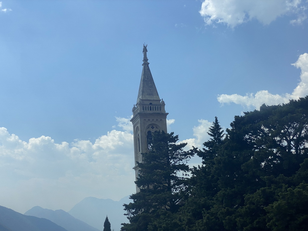 The tower of the Church of Saint Eustahije at the town of Dobrota, viewed from the tour bus on the E65 road