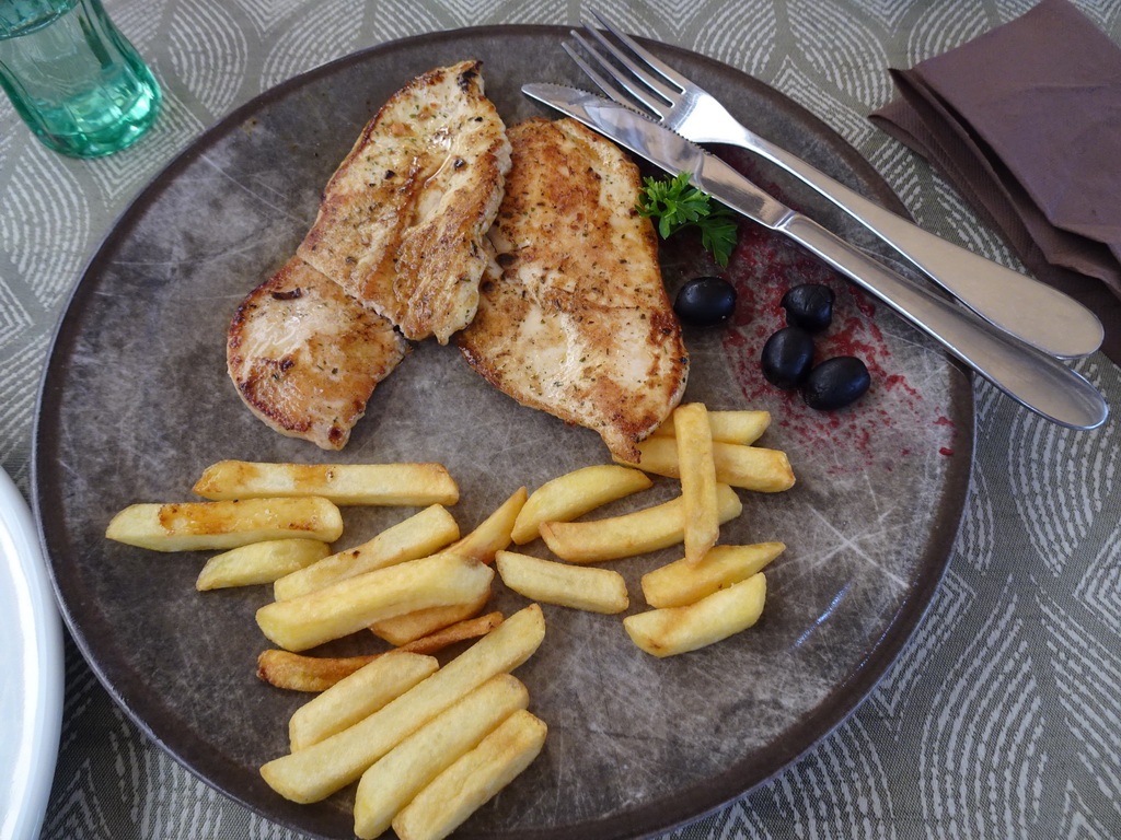 Meat and fries at the terrace of the Regina Del Gusto restaurant