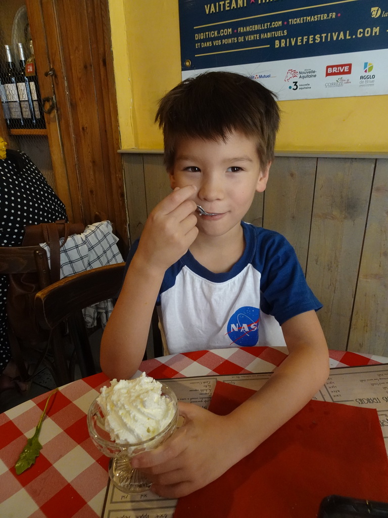 Max having ice cream at the Le Domaine de Chavagnac restaurant