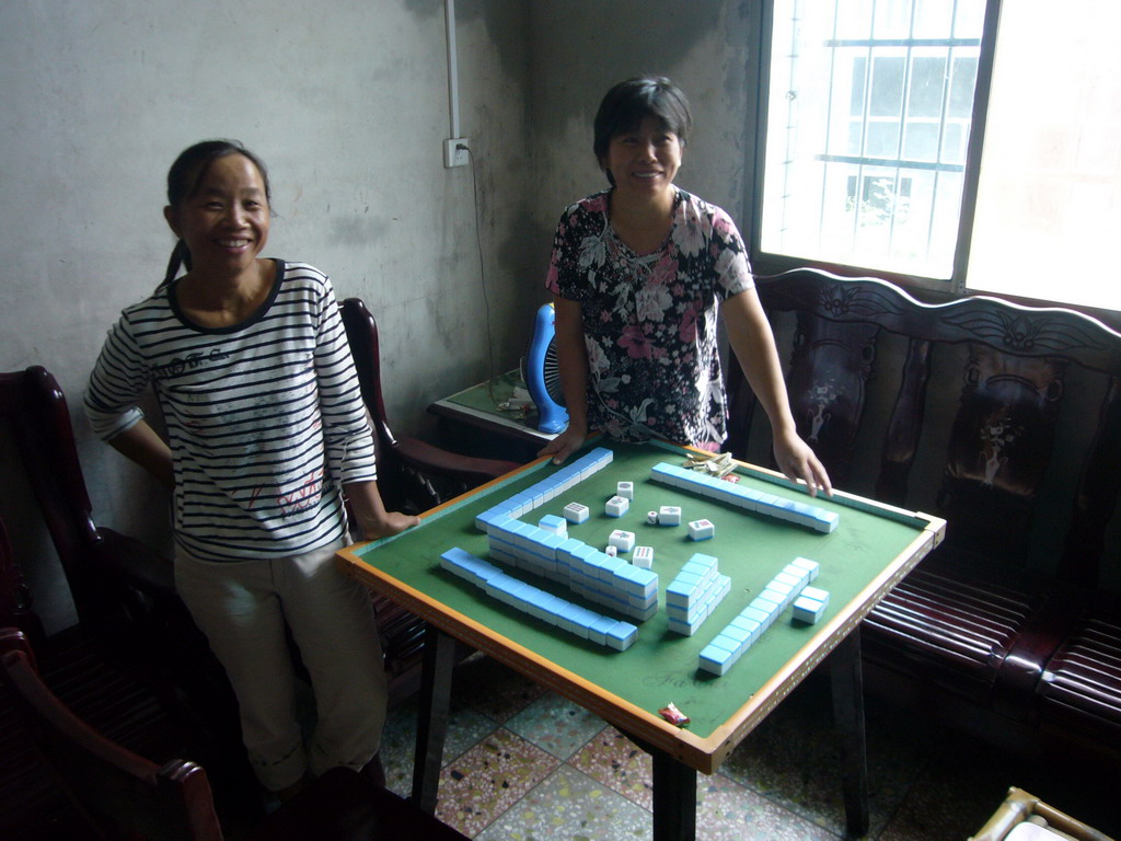 People from Miaomiao`s grandparents` village at the Mahjong table