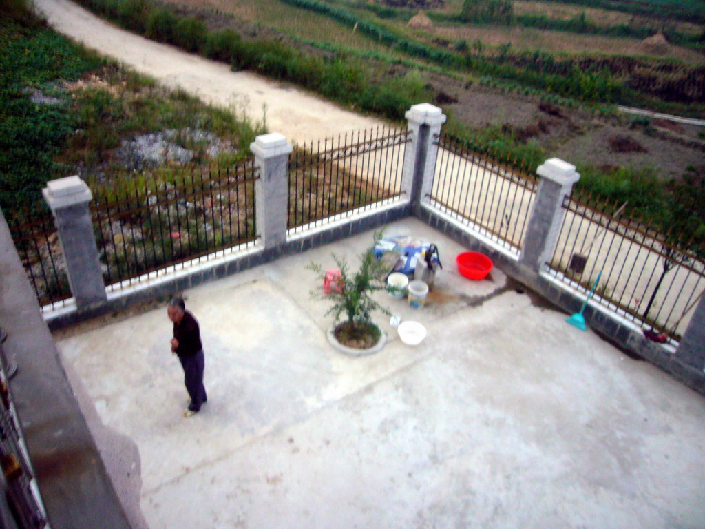 Miaomiao`s grandfather in front of her grandparents` house