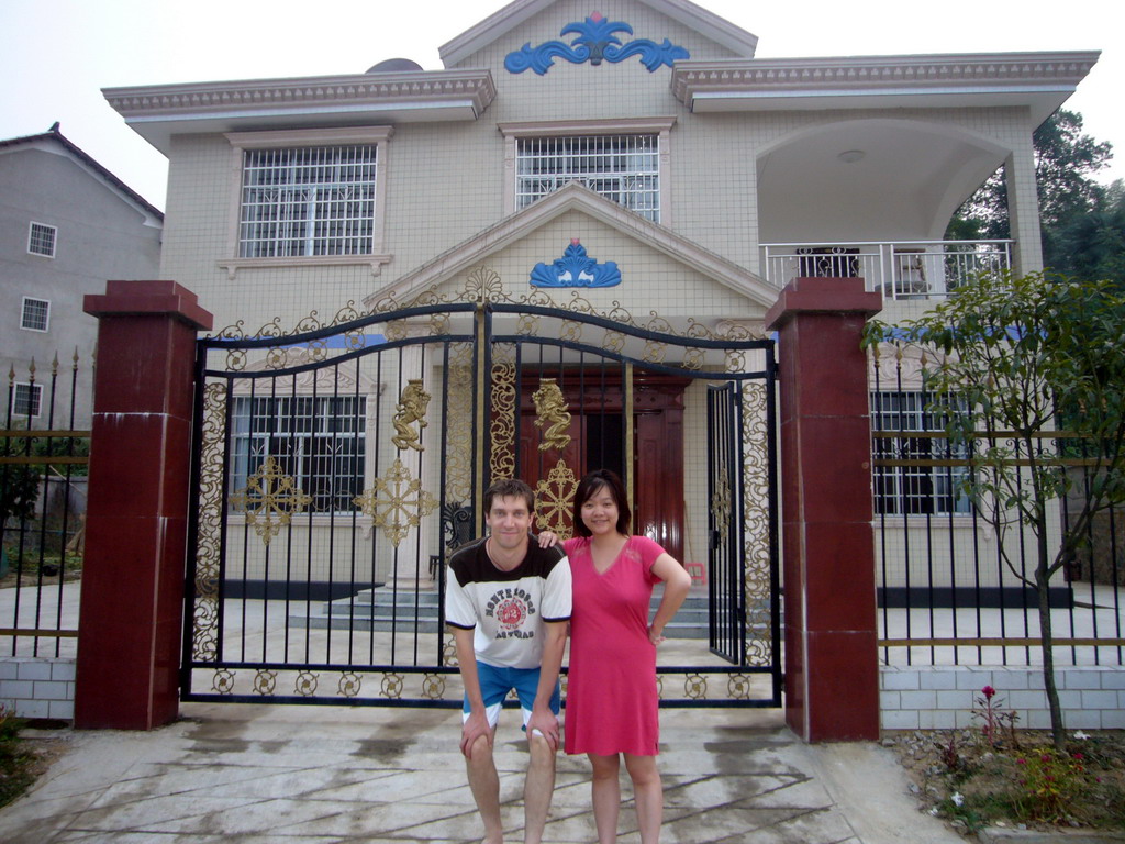 Tim and Miaomiao at the front gate of Miaomiao`s grandparents` house