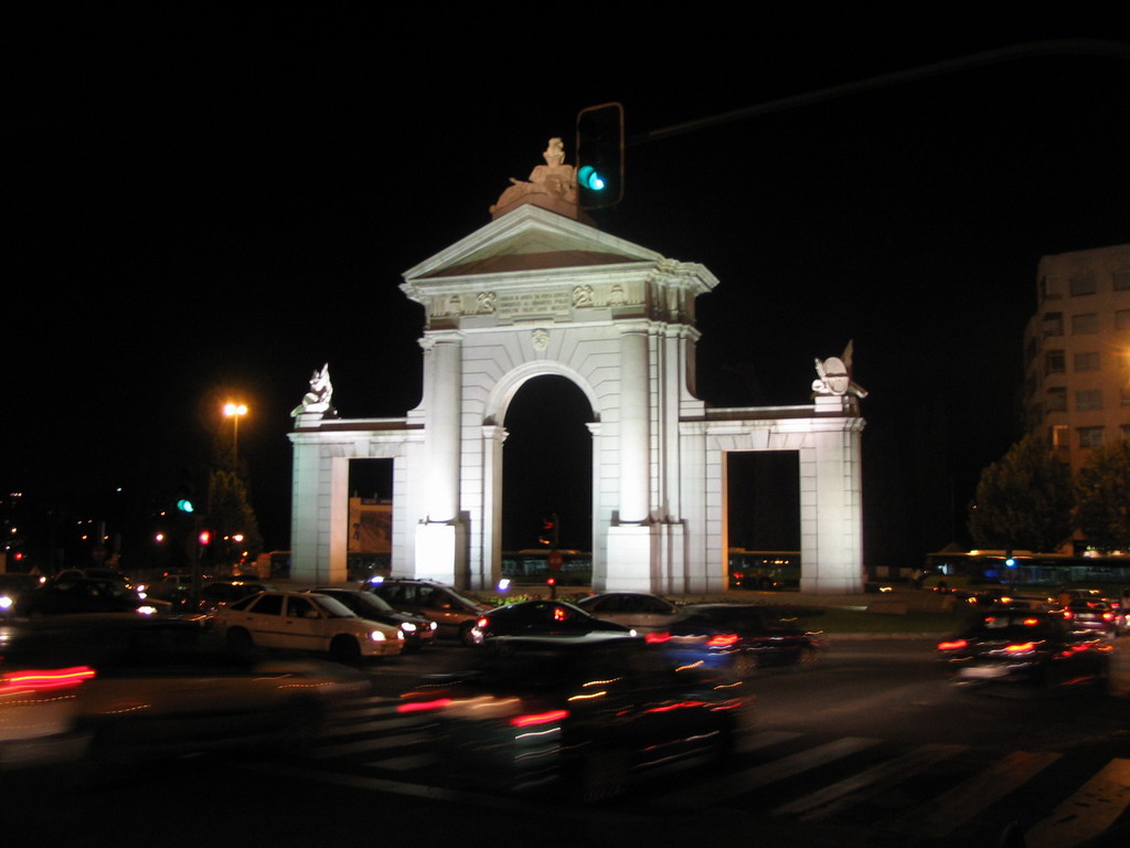 The Puerta de San Vicente gate at the Glorieta San Vicente square, by night