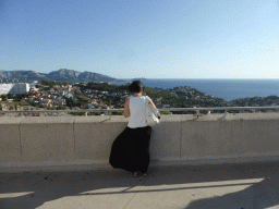 Miaomiao at the southwest side of the square around the Notre-Dame de la Garde basilica, with a view on the Massif des Calanques mountain range and the south side of the city