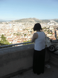 Miaomiao at the southeast side of the square around the Notre-Dame de la Garde basilica, with a view on the east side of the city with the Stade Vélodrome stadium and the Mont Puget mountain