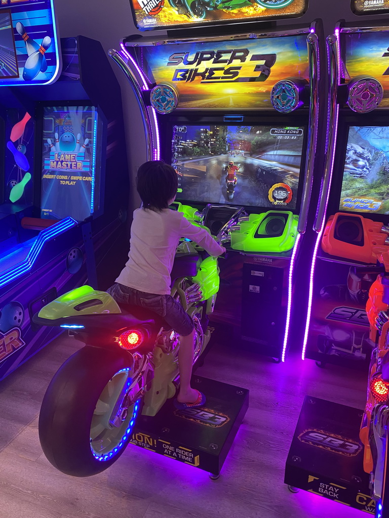 Max playing `Super Bikes 3` at the gaming room at the Abora Buenaventura by Lopesan hotel