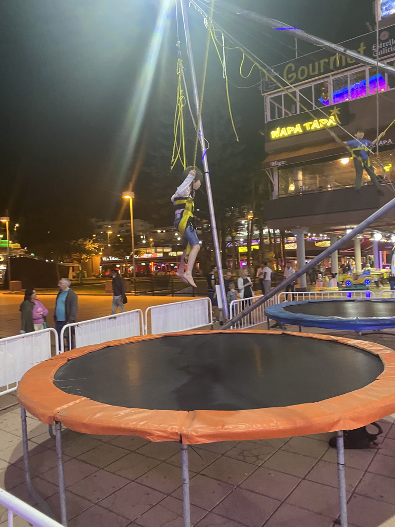 Max jumping at the bungee trampoline at the Yumbo Centrum shopping mall, by night