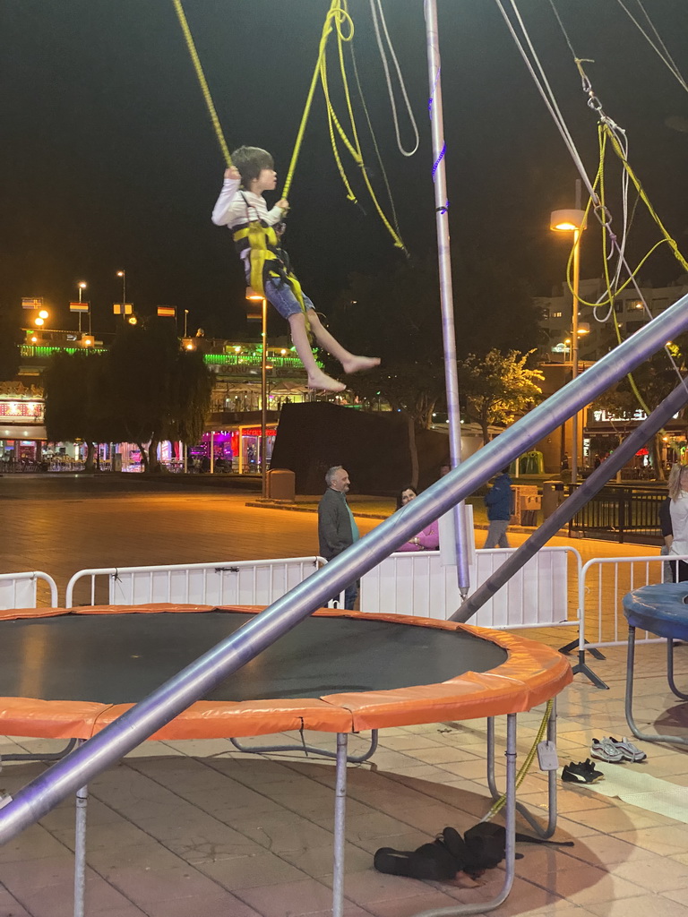 Max jumping at the bungee trampoline at the Yumbo Centrum shopping mall, by night