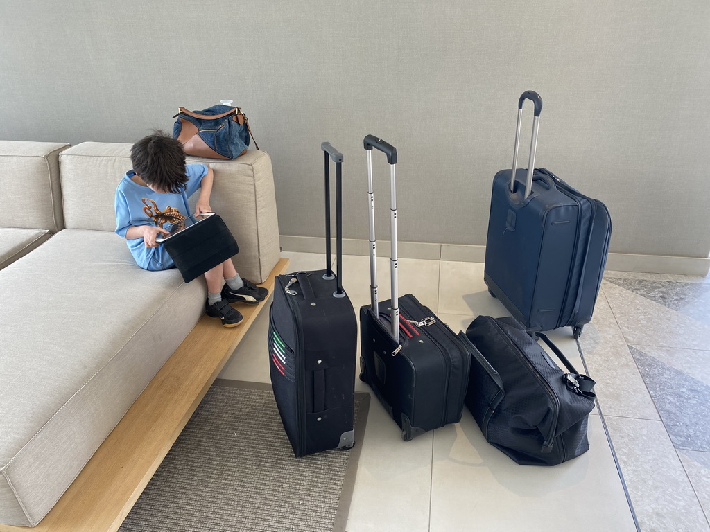 Max playing with iPad and our suitcases in the lobby of the Abora Buenaventura by Lopesan hotel