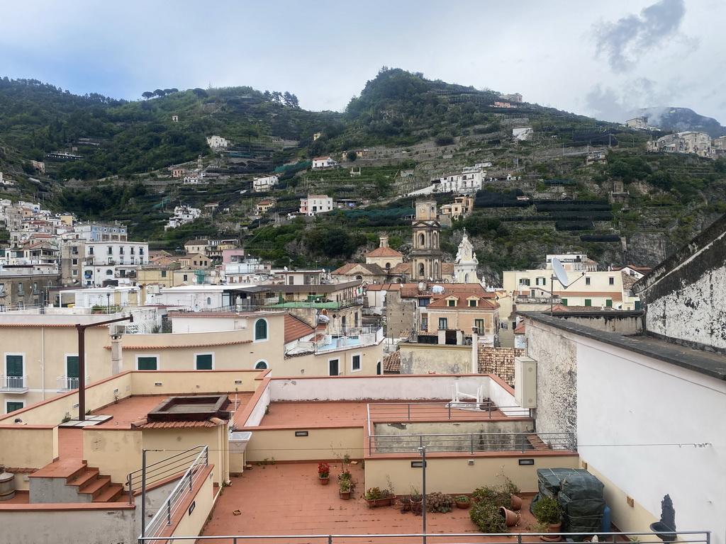 Rooftops, the tower of the Basilica di Santa Trofimena church and buildings at the town center, viewed from the staircase from the Via Alfonso Gatto street to the Via Caruseillo street