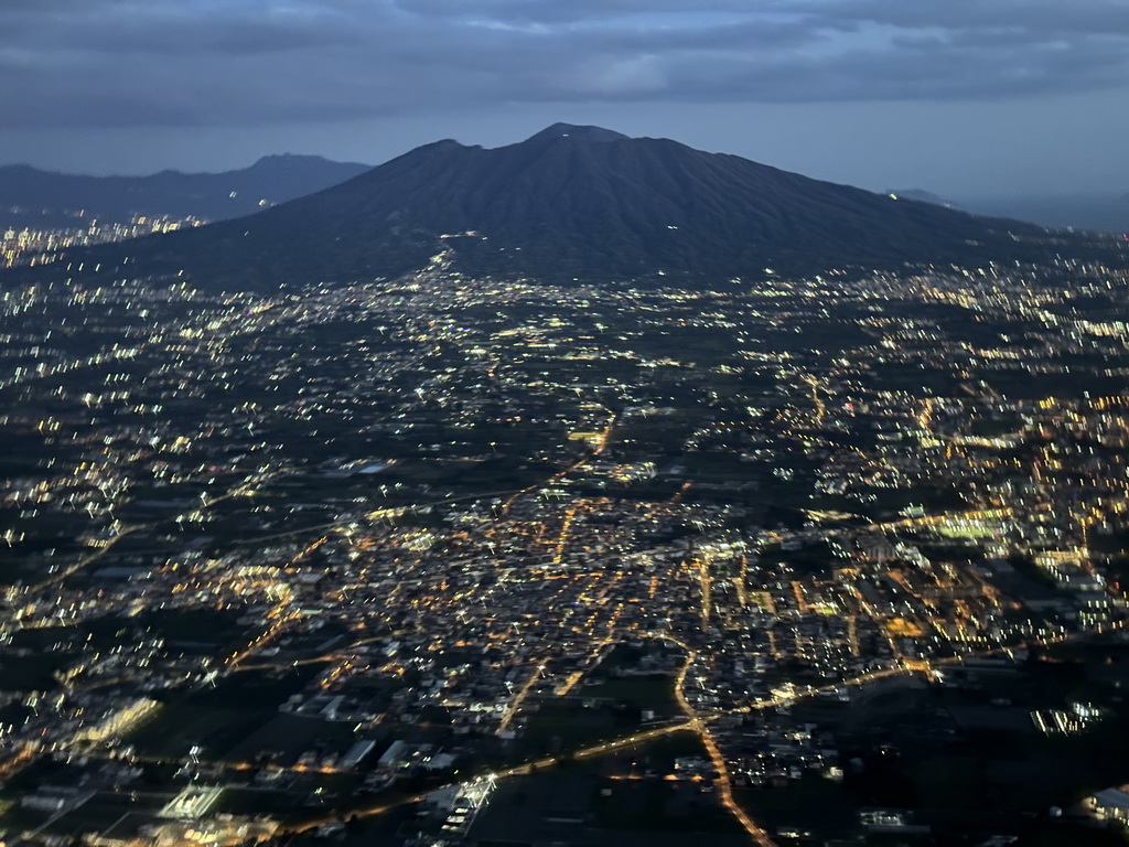 The east side of the city and Mount Vesuvius, viewed from the airplane from Eindhoven, at sunset