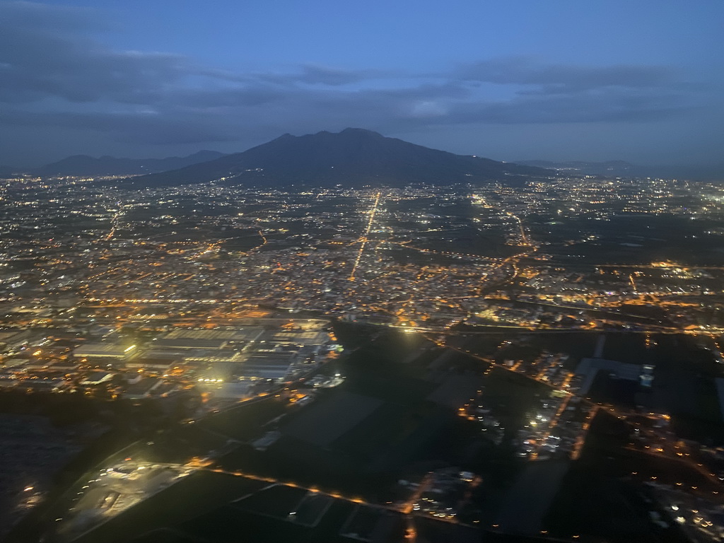 The east side of the city and Mount Vesuvius, viewed from the airplane from Eindhoven, at sunset