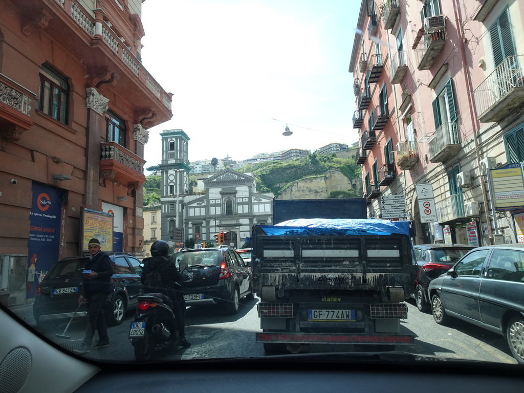 The Piazza Piedigrotta square with the Chiesa di Santa Maria di Piedigrotta church, viewed from the rental car on the Via Piedigrotta street