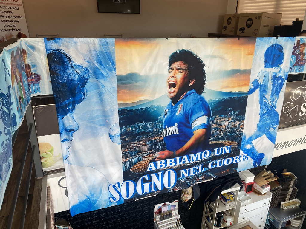 Diego Armando Maradona poster at the Caffé Torlado restaurant, viewed from the staircase