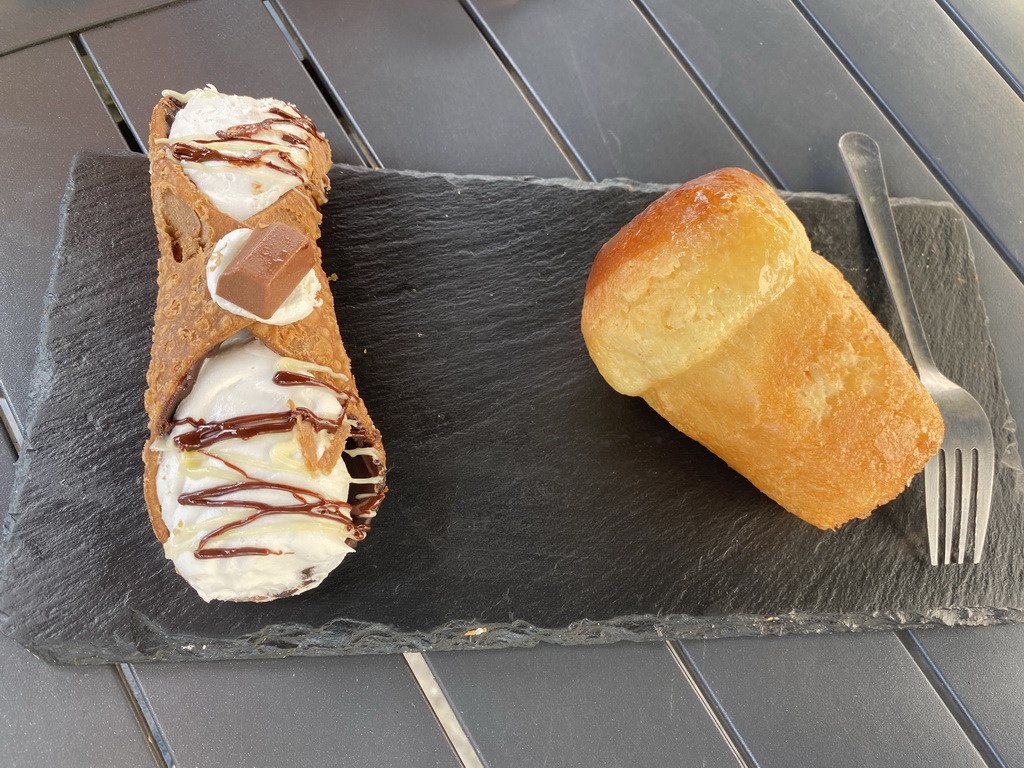 Cakes at the terrace of the Caffé Torlado restaurant at the Via Cristoforo Colombo street