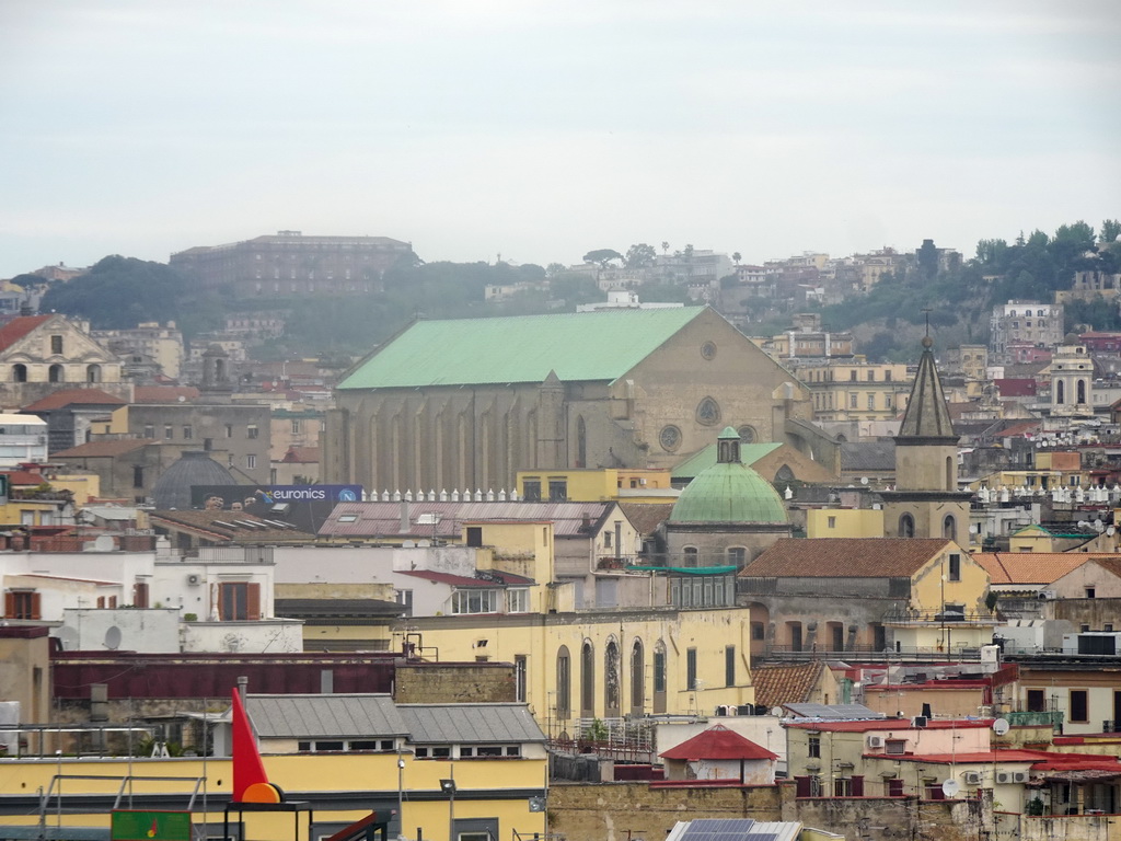 The city center with the Museo Di Santa Chiara museum and the Reggia di Capodimonte museum, viewed from the north side of the roof of the Castel Nuovo castle