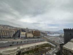 Northeast side of the roof of the Castel Nuovo castle with the Beverello Tower, ruins at the Piazza Municipio square, the Naples Port, the city center and Mount Vesuvius