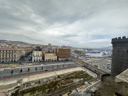 Northeast side of the roof of the Castel Nuovo castle with the Beverello Tower, ruins at the Piazza Municipio square, the Naples Port and the city center