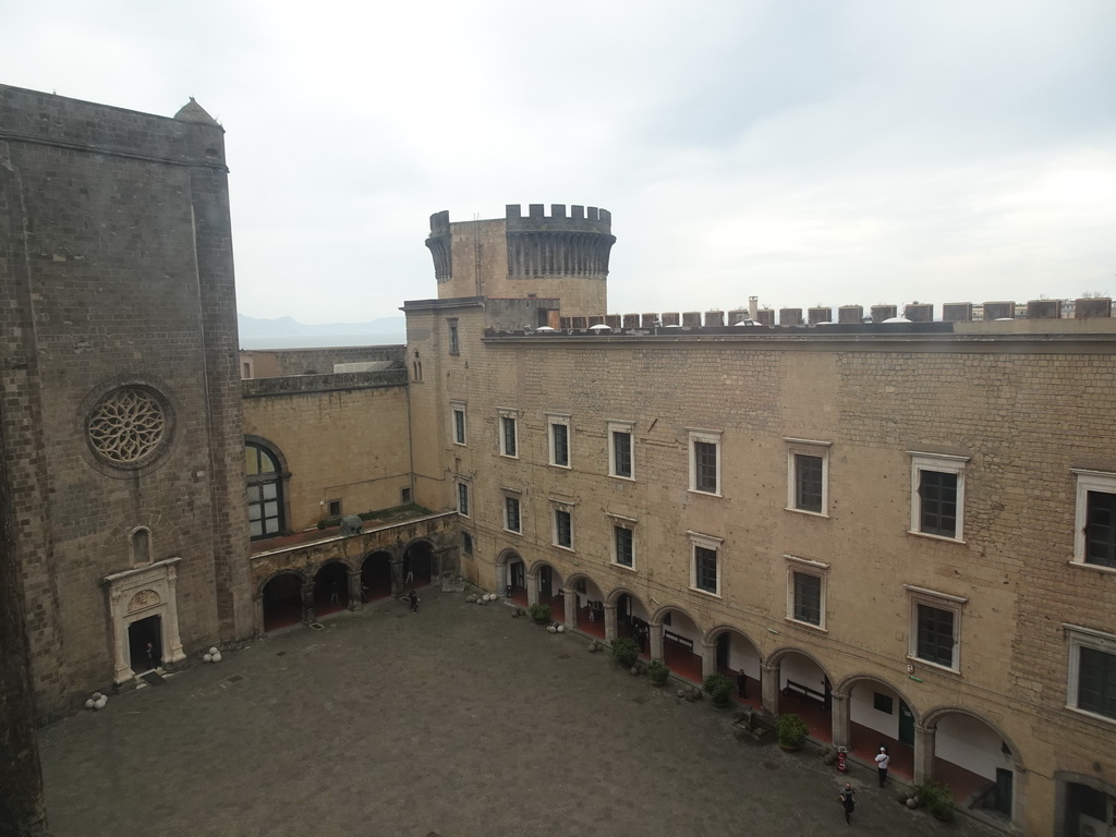 Inner square of the Castel Nuovo castle with the Gold Tower and the front of the Palatine Chapel and the Civic Museum, viewed from the northwest side of the roof