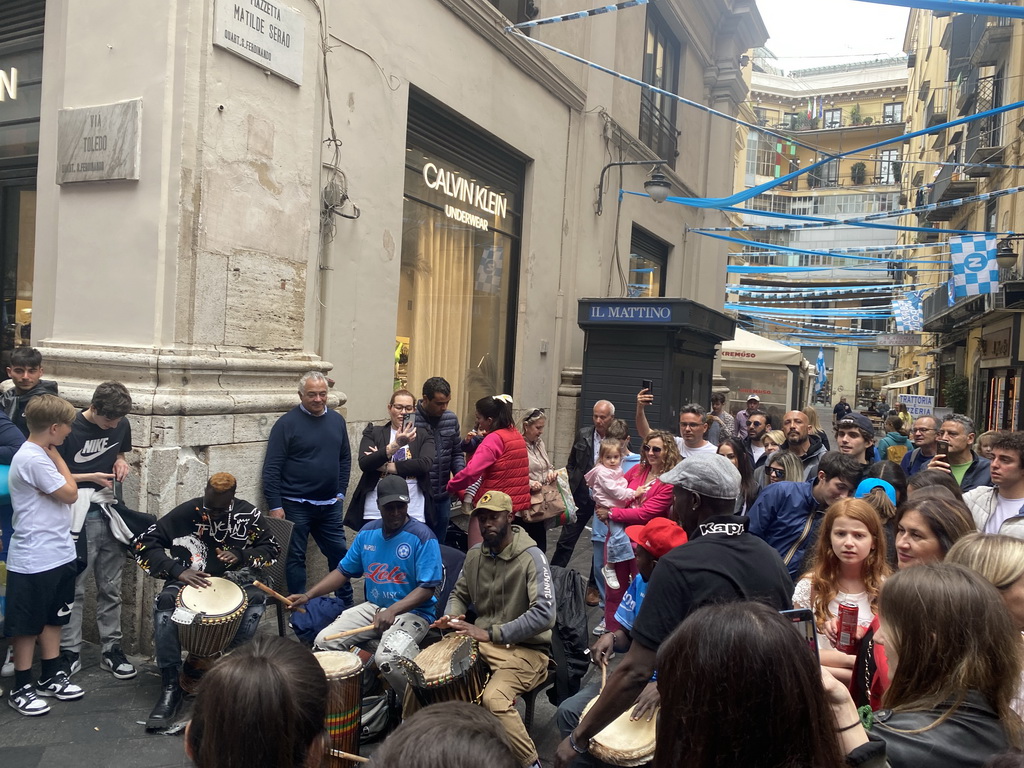 Street musicians and decorations for SSC Napoli`s third Italian championship at the crossing of the Via Toledo street and the Piazzetta Matilde Serao square