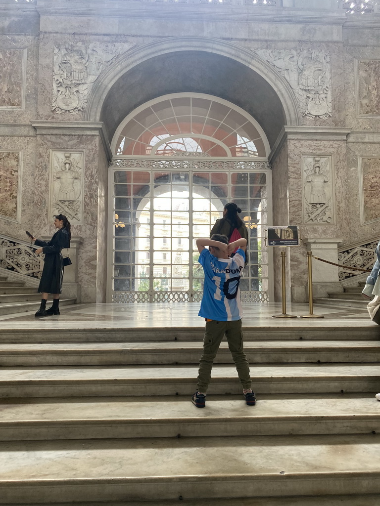 Max showing his new Diego Armando Maradona shirt at the main staircase at the Royal Palace of Naples