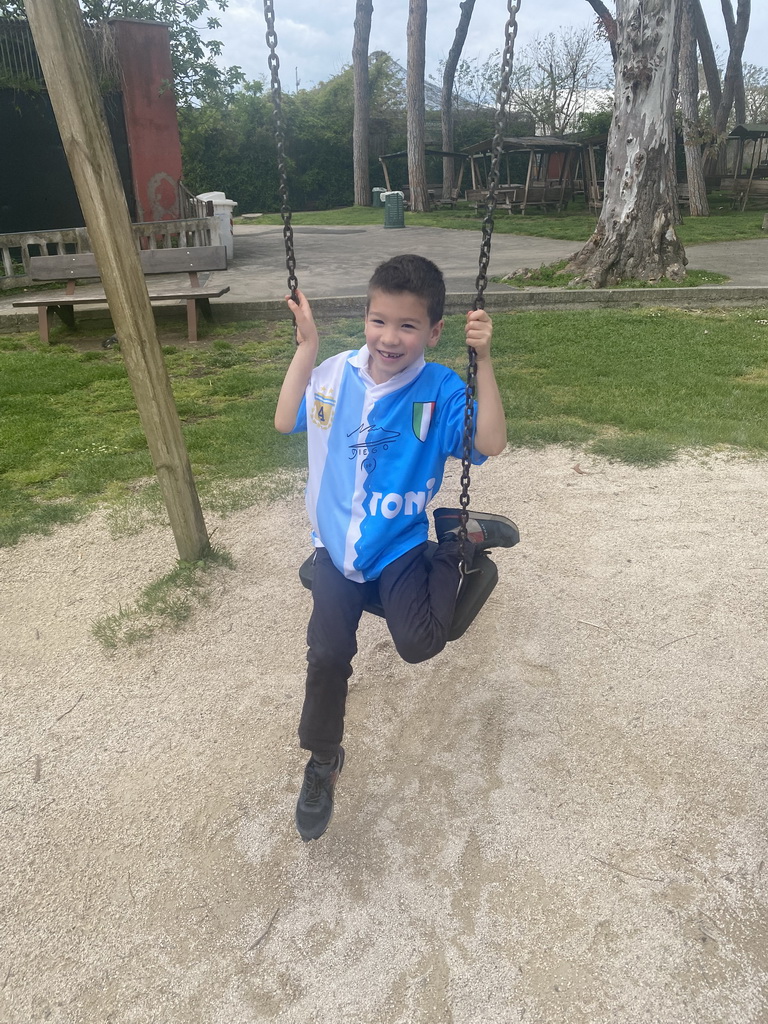 Max on a swing at the main playground at the Zoo di Napoli