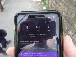 iPhone screen with the score of the match Internazionale - Lazio Roma at the Via Terracina street