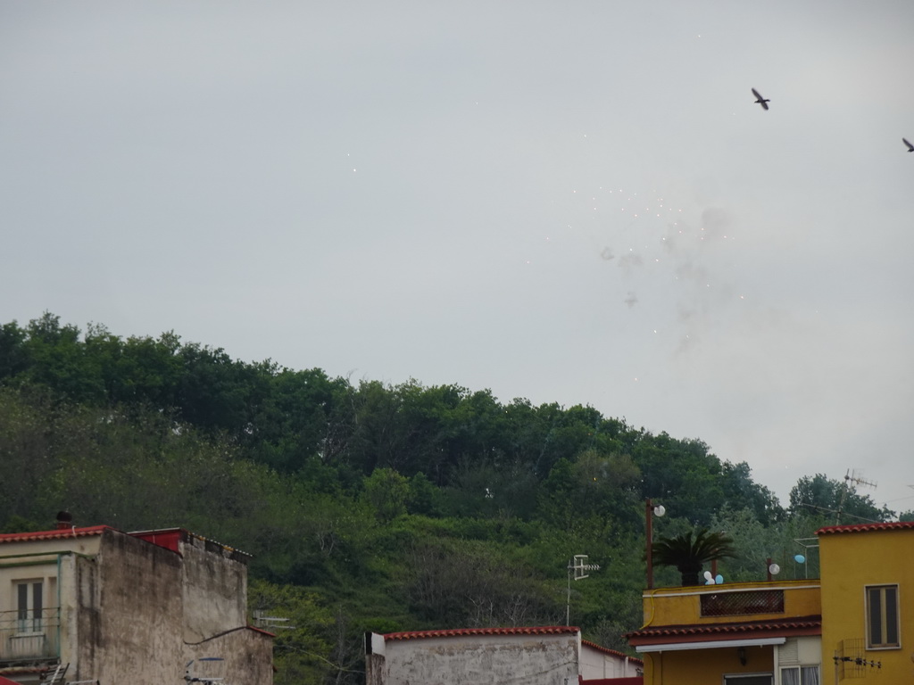 Fireworks above the west side of the city, viewed from the Via Terracina street