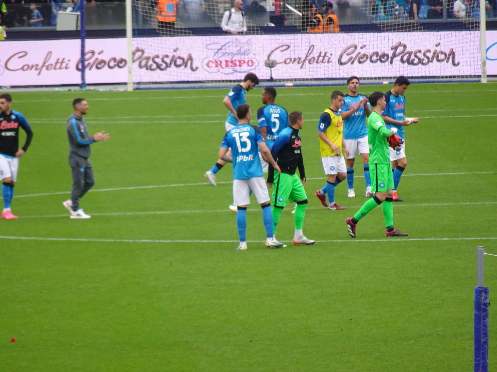 Players on the pitch at the Stadio Diego Armando Maradona stadium, viewed from the Curva A Inferiore grandstand, right after the football match SSC Napoli - Salernitana