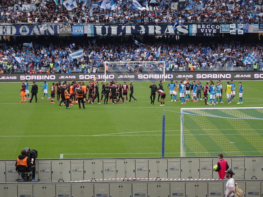 Players on the pitch at the Stadio Diego Armando Maradona stadium, viewed from the Curva A Inferiore grandstand, right after the football match SSC Napoli - Salernitana