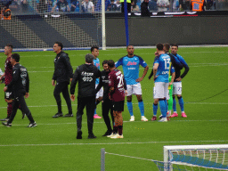 Players on the pitch at the Stadio Diego Armando Maradona stadium, viewed from the Curva A Inferiore grandstand, right after the football match SSC Napoli - Salernitana