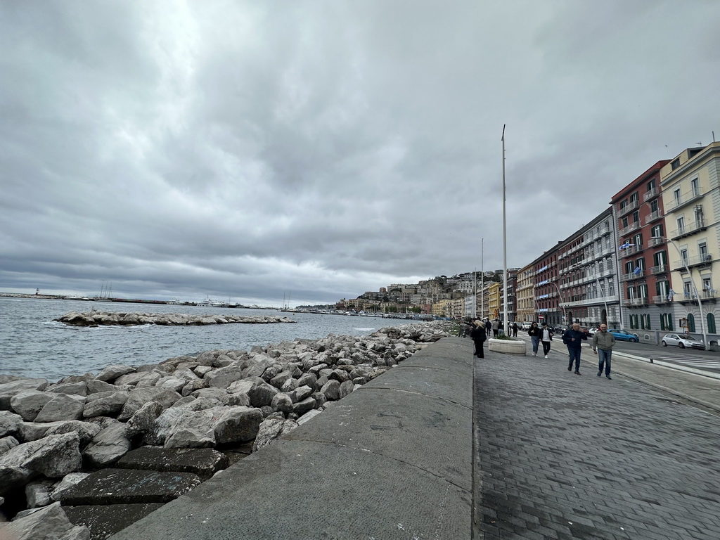 The beach at the Via Caracciolo Francesco street and boats at the Sannazaro Port