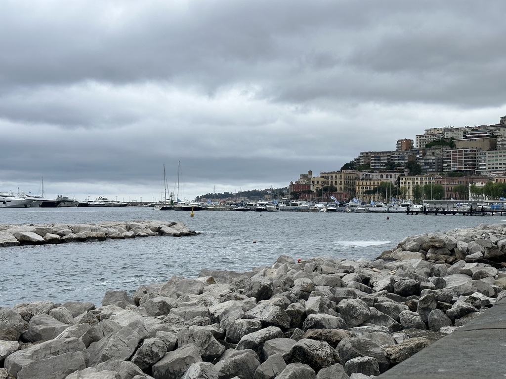 The beach at the Via Caracciolo Francesco street and boats at the Sannazaro Port