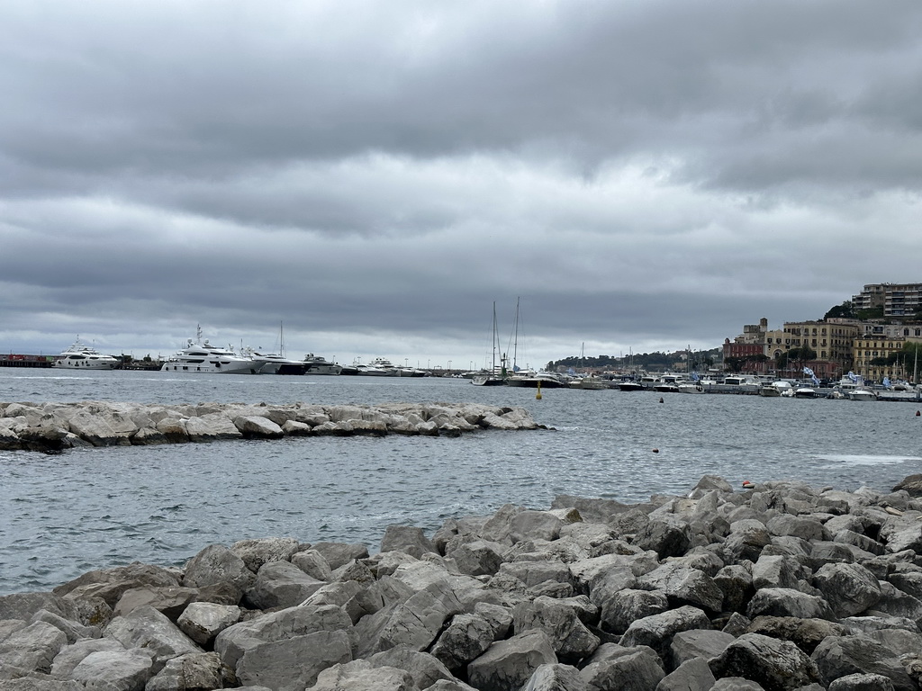 The beach at the Via Caracciolo Francesco street and boats at the Sannazaro Port