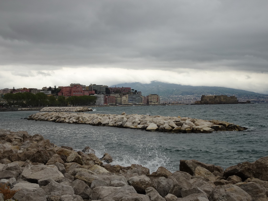 The beach at the Via Caracciolo Francesco street, with a view on the city center with the Castel dell`Ovo castle and Mount Vesuvius