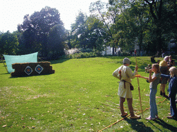 People shooting arrows at the Kronenburgerpark, during the Gebroeders van Limburg Festival