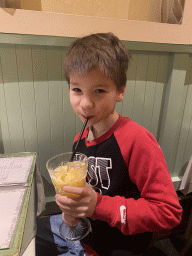 Max drinking a Mango Lassi at the India Gate restaurant