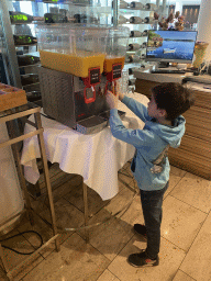 Max getting a drink at the Restaurant Flow at the Ground Floor of the Sanadome Hotel & Spa