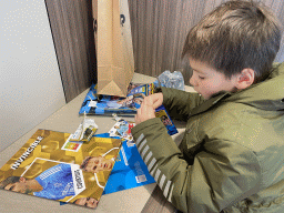 Max with football cards at the Frituur De Burcht restaurant at the Burchtstraat street