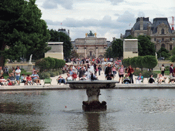 The Grand Bassin Rond in the Tuileries Garden, the Arc de Triomphe du Carousel and the Louvre Museum