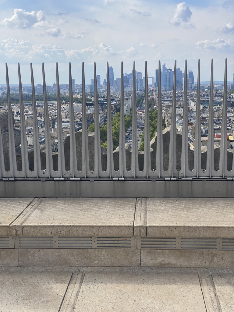 The roof of the Arc de Triomphe, with a view on the Avenue de la Grande Armée and the La Défense district with the Grande Arche de la Défense building