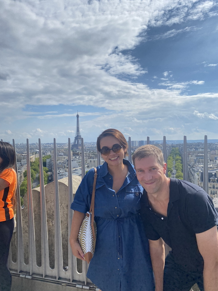 Tim and Miaomiao on the roof of the Arc de Triomphe, with a view on the Eiffel Tower