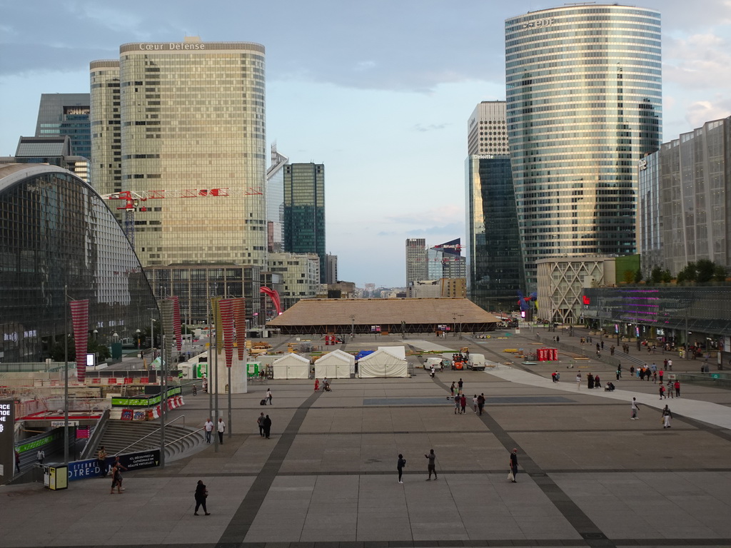 The CNIT shopping mall, skyscrapers and the Westfield Les 4 Temps shopping mall at the Parvis de la Défense square and the Arc de Triomphe, viewed from below the Grande Arche de la Défense building, at sunset