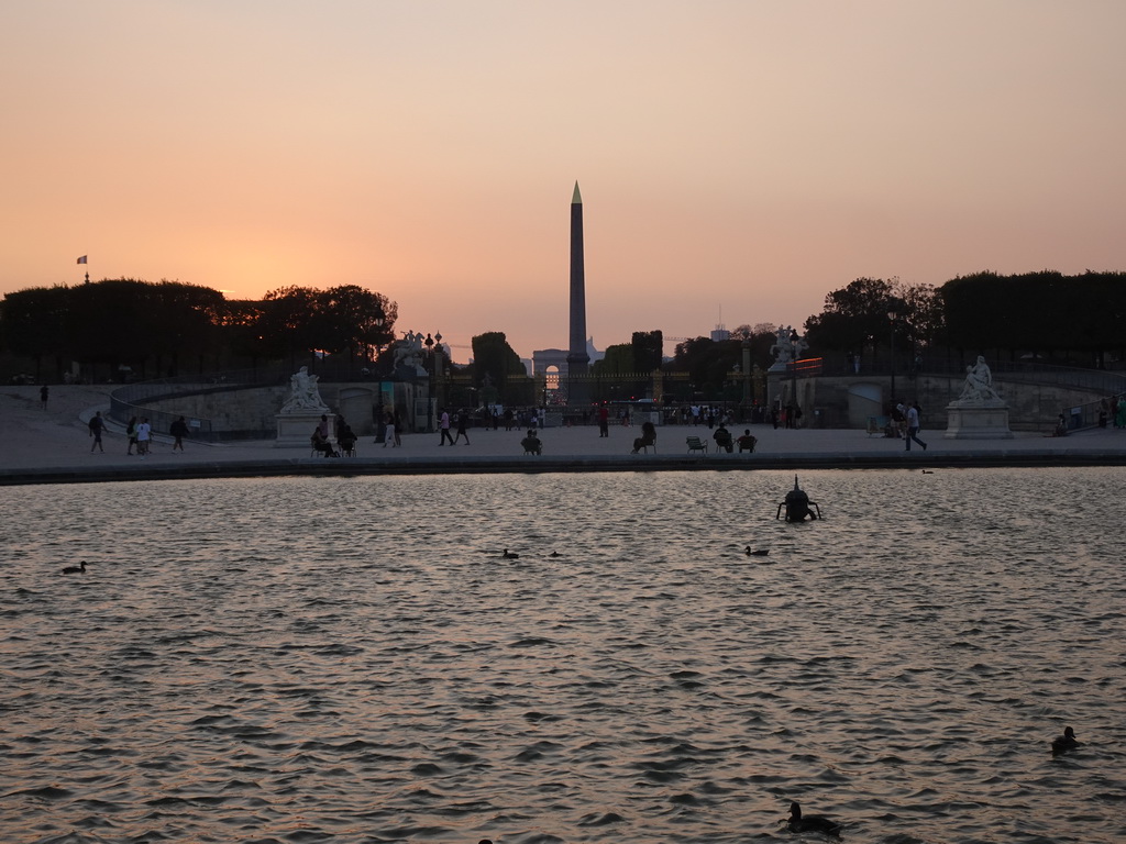 The Bassin Octogonal pond at the Tuileries Gardens, the Place de la Concorde square with the Luxor Obelisk and the Arc de Triomphe