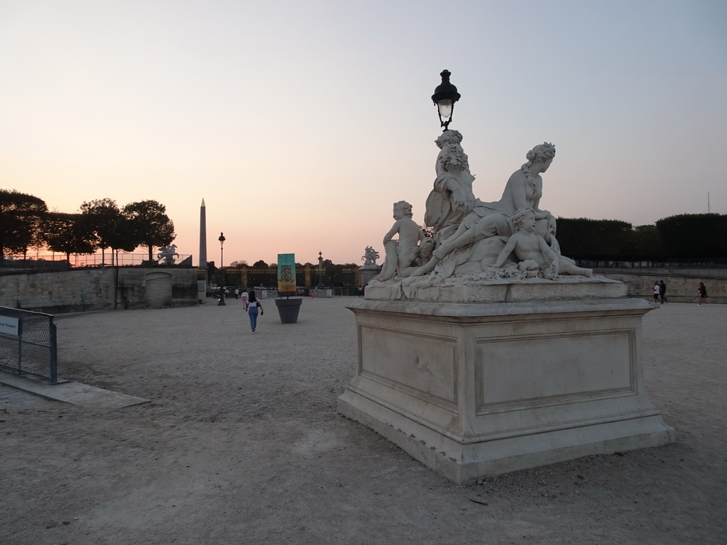 Sculpture at the Tuileries Gardens and the Place de la Concorde square with the Luxor Obelisk