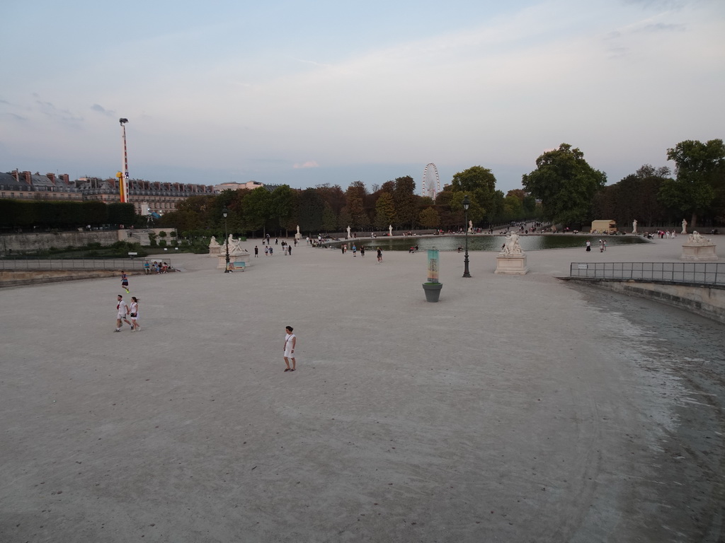 The west side of the Tuileries Gardens with the Bassin Octogonal pond and the Ferris Wheel, viewed from the Terrasse de l`Orangerie terrace