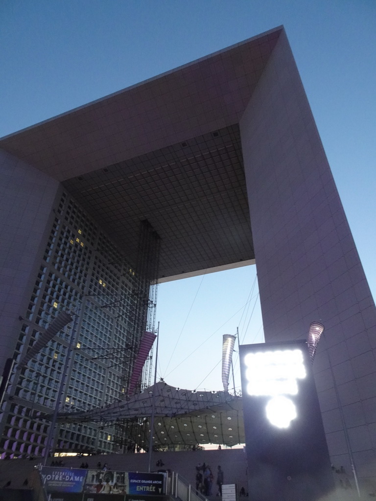 Front of the Grande Arche de la Défense building at the Parvis de la Défense square, viewed from the entrance of the La Défense railway station, by night