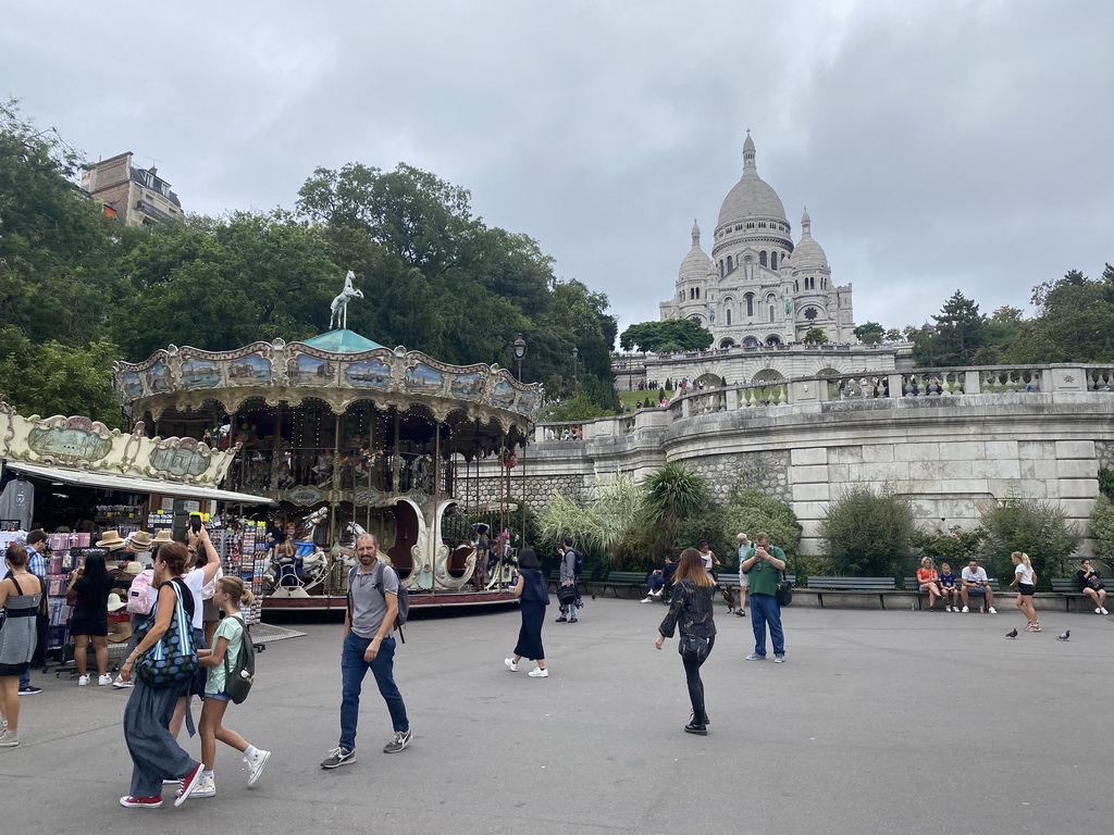 Souvenir shop and the Carrousel de Saint-Pierre at the Place Saint-Pierre square, the Square Louise Michel and the front of the Basilique du Sacré-Coeur church